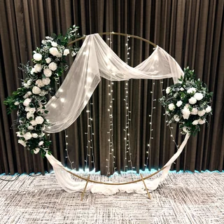 Round ceremony arch — styled with lights — Lakeside Tent Co, Kelowna